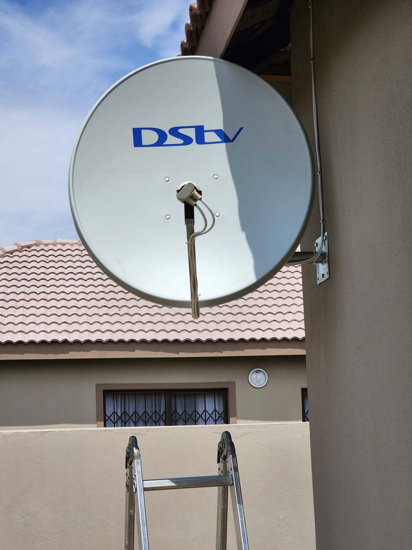 DStv satellite dish installed on a wall bracket at a Glen Marais home